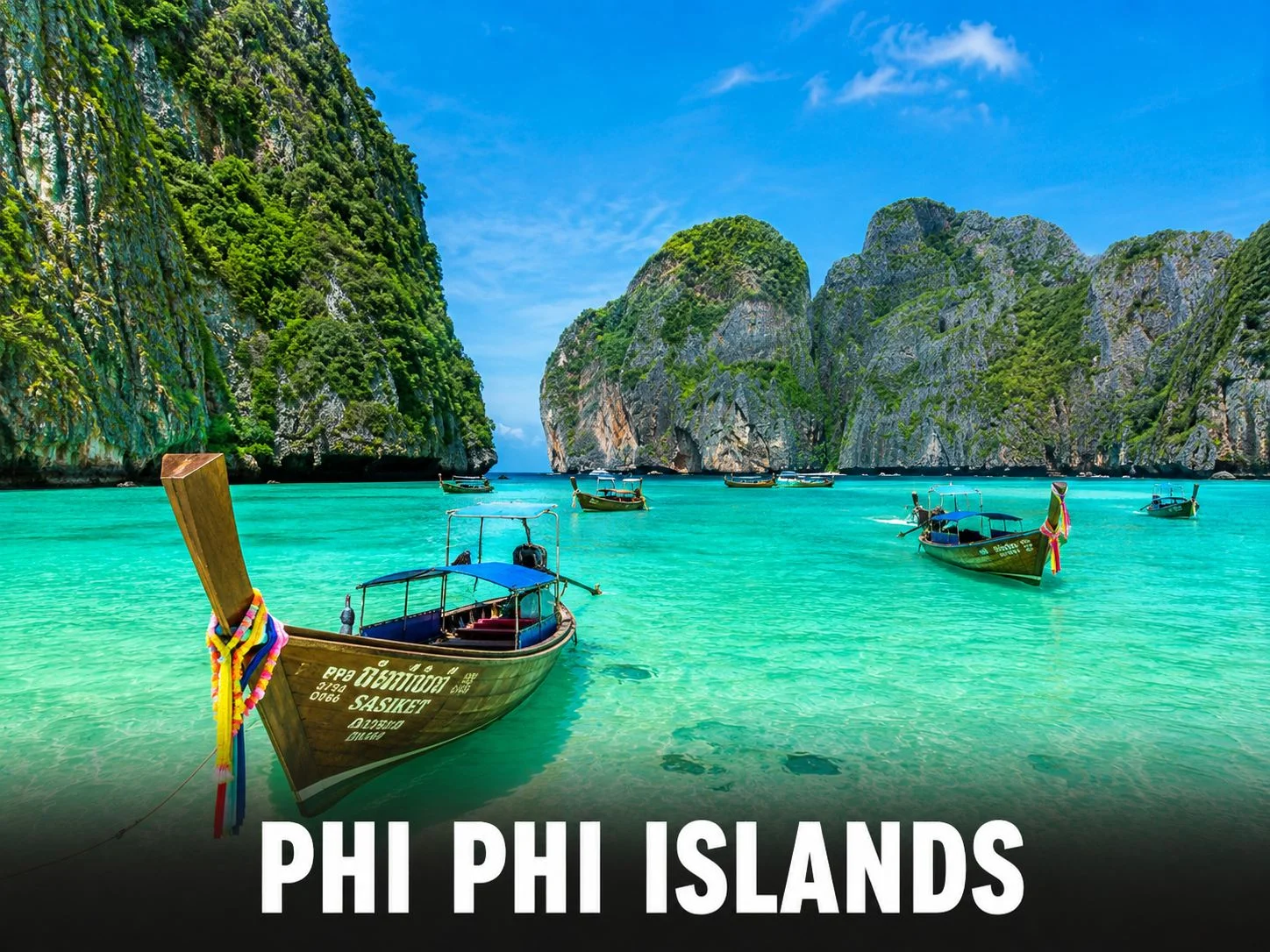 Crystal-clear turquoise waters of Phi Phi Islands viewed from a longtail boat on a day trip from Patong, Phuket