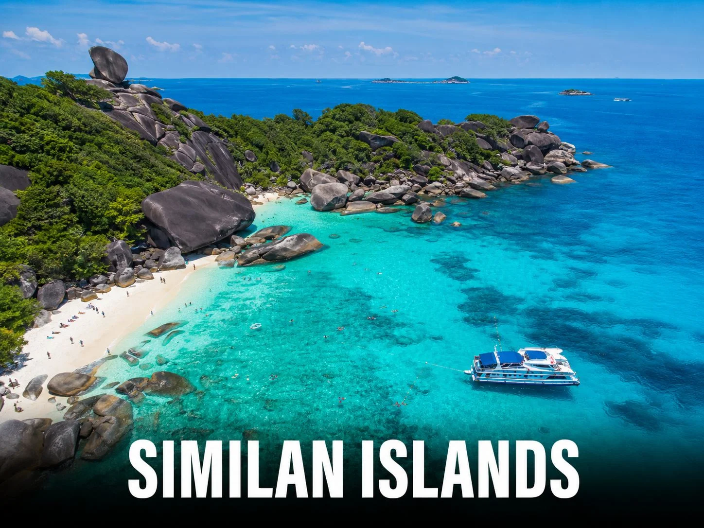 Crystal-clear turquoise waters and granite boulders of the Similan Islands, viewed from a day trip speedboat from Phuket